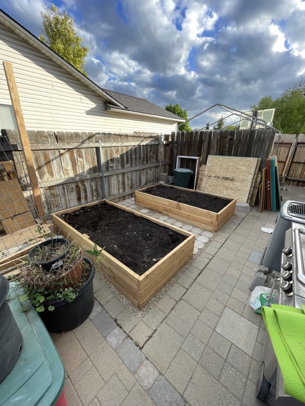 Custom raised garden beds on paver patio